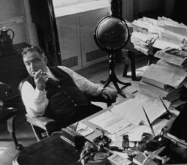 Cigar in hand: Mayor Fiorello LaGuardia in his famously messy office.